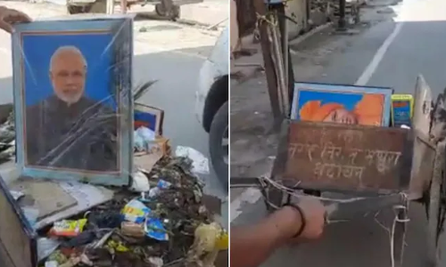 मोदी-योगींचे फोटो कचऱ्यात, सफाई कर्मचारी बडतर्फ